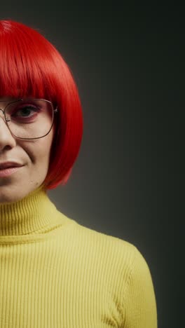 woman with red wig and yellow sweater