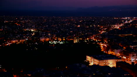 beautiful establishing panning shot of athens greece and the acropolis at dusk or night
