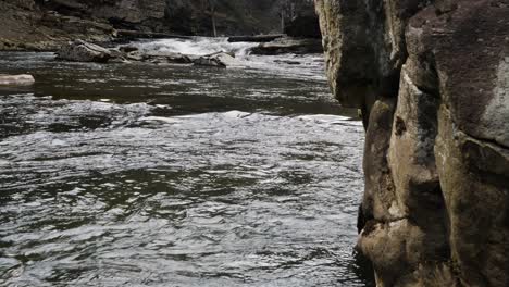 linville falls river flowing rock in foreground