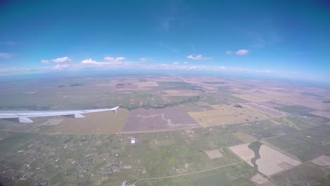 A-bank-turn-from-the-window-of-a-passenger-jet-as-it-flies-over-the-midwest