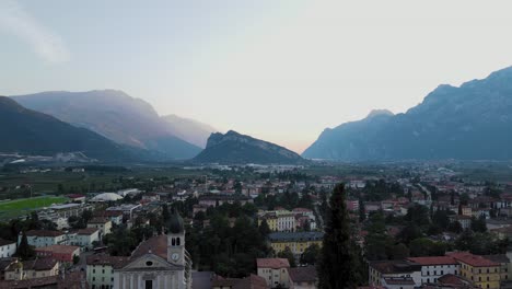 Aerial-panoramic-shot-with-fog-and-mountains-on-background