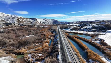 incredible aerial view of jordan river and railway in bluffdale utah - truck right and panning movement