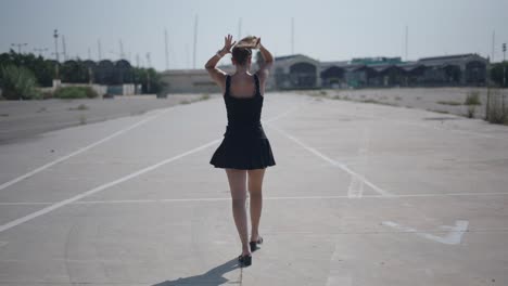 woman walking on an empty parking lot