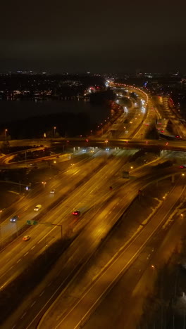 vertical drone shot of traffic on route 51 lansivayla, night in espoo, finland