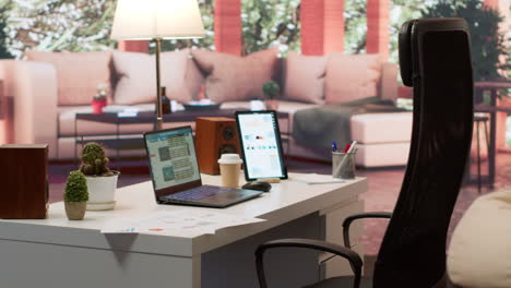 empty modern home workstation of an entrepreneur with laptop and tablet