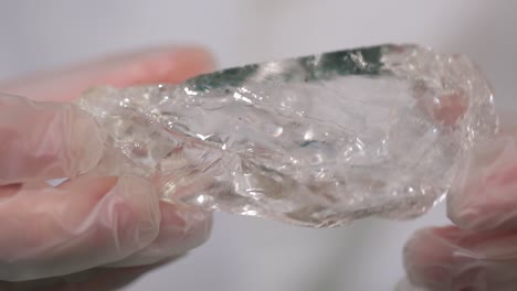 crystal in gloved hands