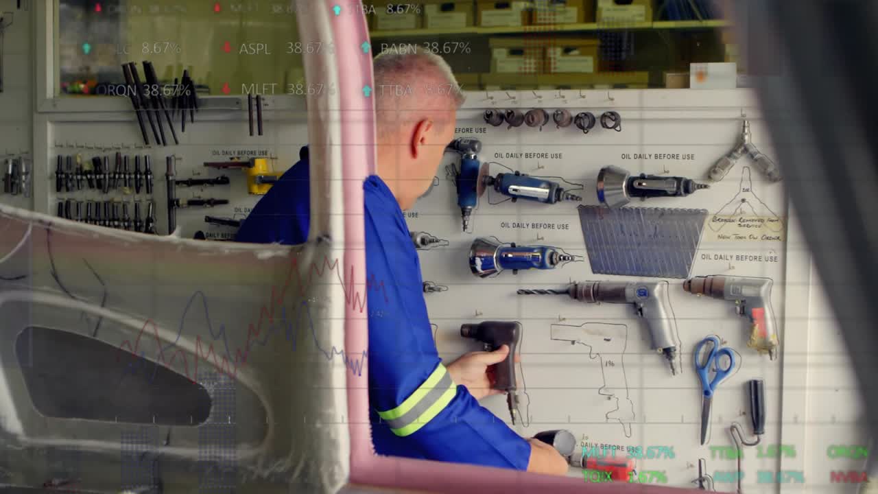 Workshop technician removing bit and snapping adapter on tool assembly with data charts overlaying