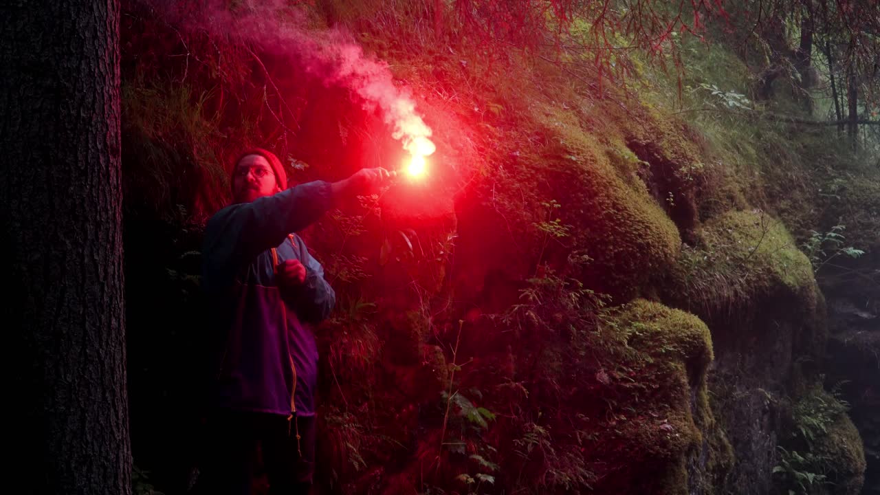 Person with Red Flare in Forest