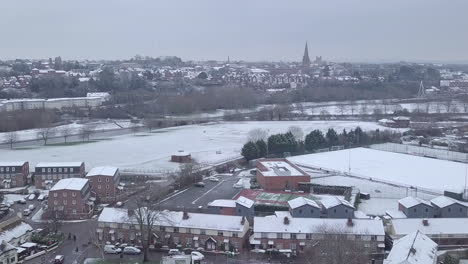 ascending drone shot of a snowy exeter looking towards the town centre crop