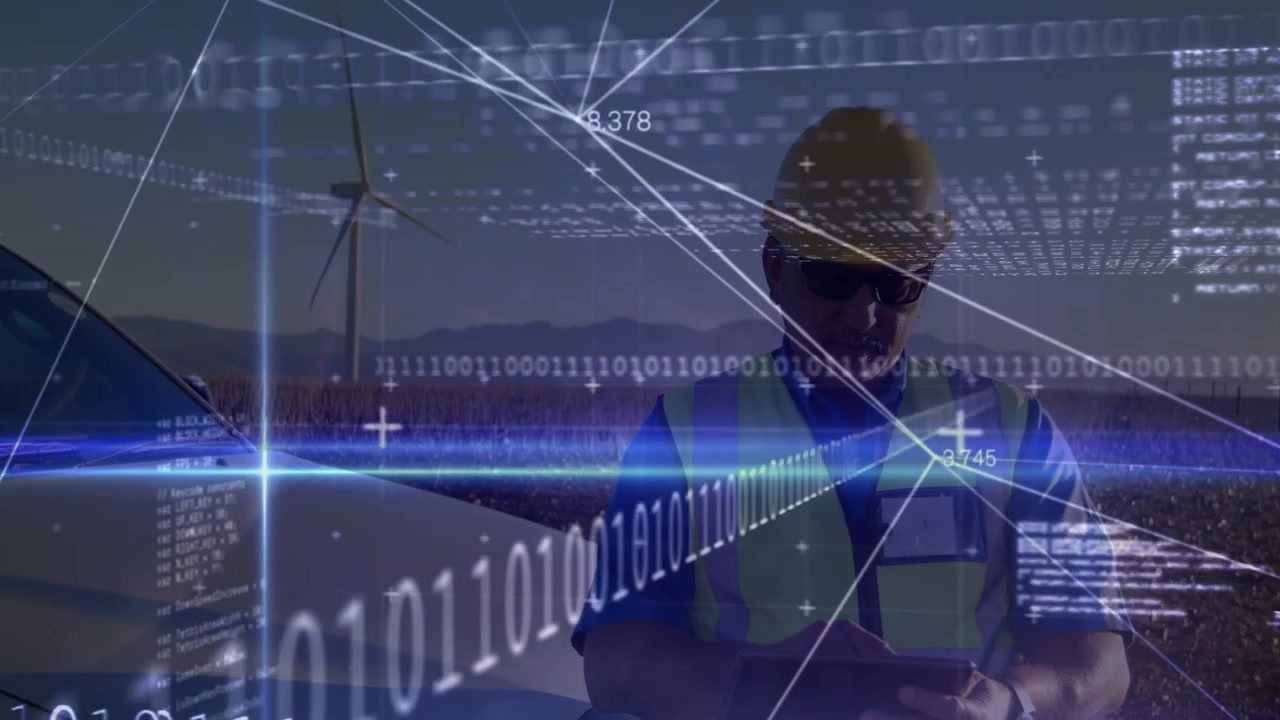 Technician picking up device sending turbine data for monitoring while HUD aligning around him