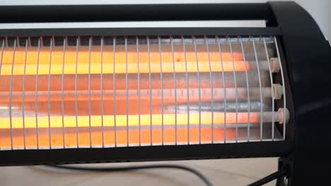 close-up of an electric heater glowing orange