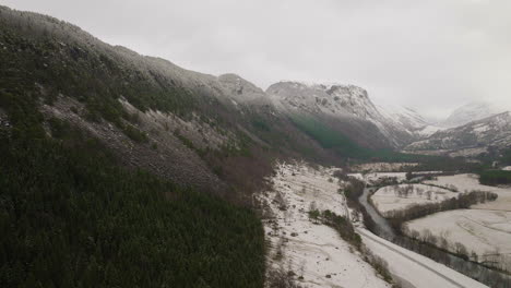 dense forest on mountain hills with valley at winter in west coast of norway