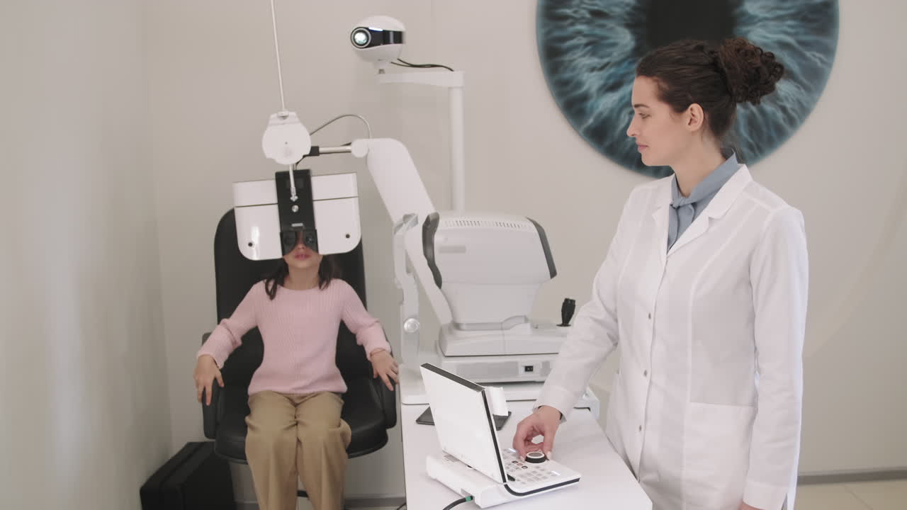 Little Girl Doing Eye Checkup In Modern Clinic