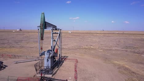 Energy-production-in-fossil-fuel-industry,-pumpjack-pumps-oil,-aerial