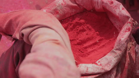 a man selling red powder