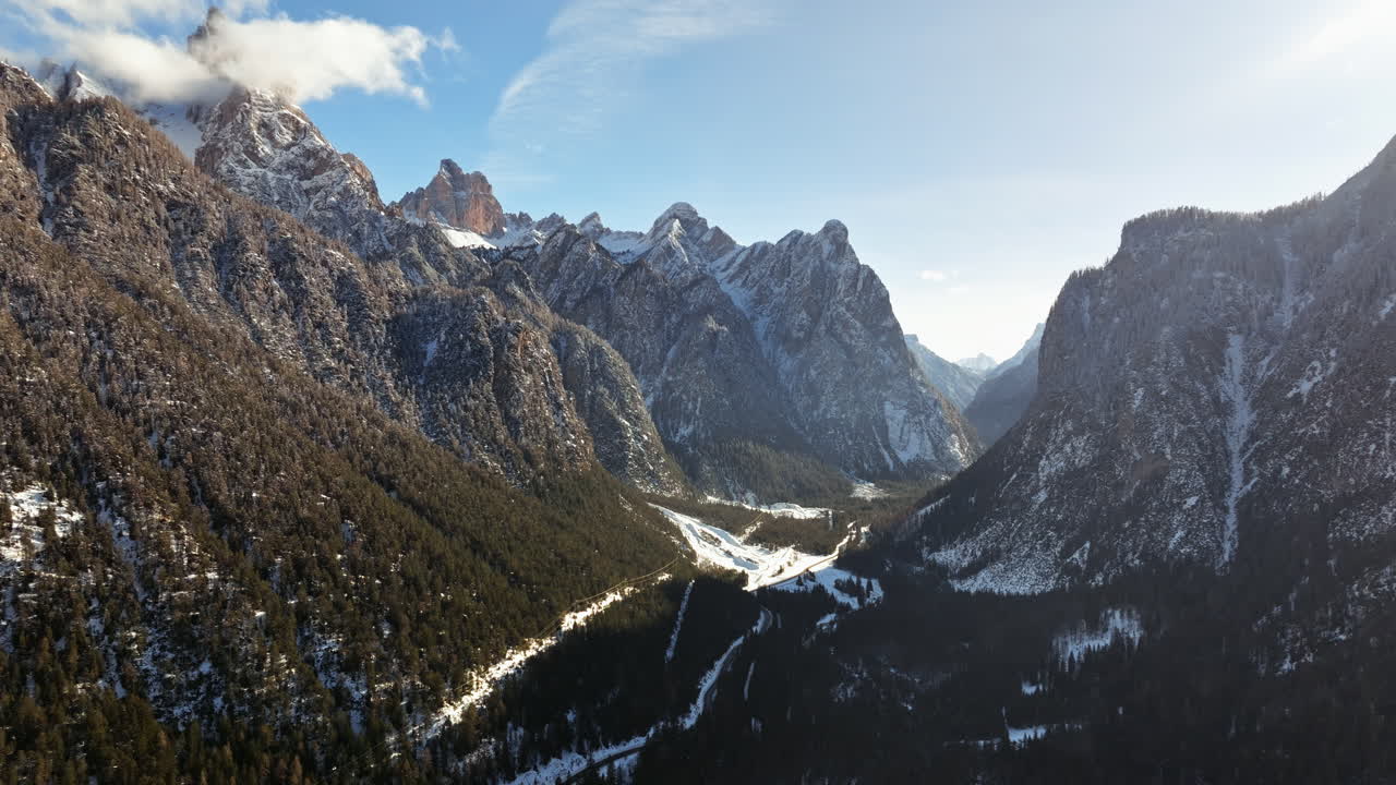 Aerial drone view of snow on the mountains in the Dolomites, Italy