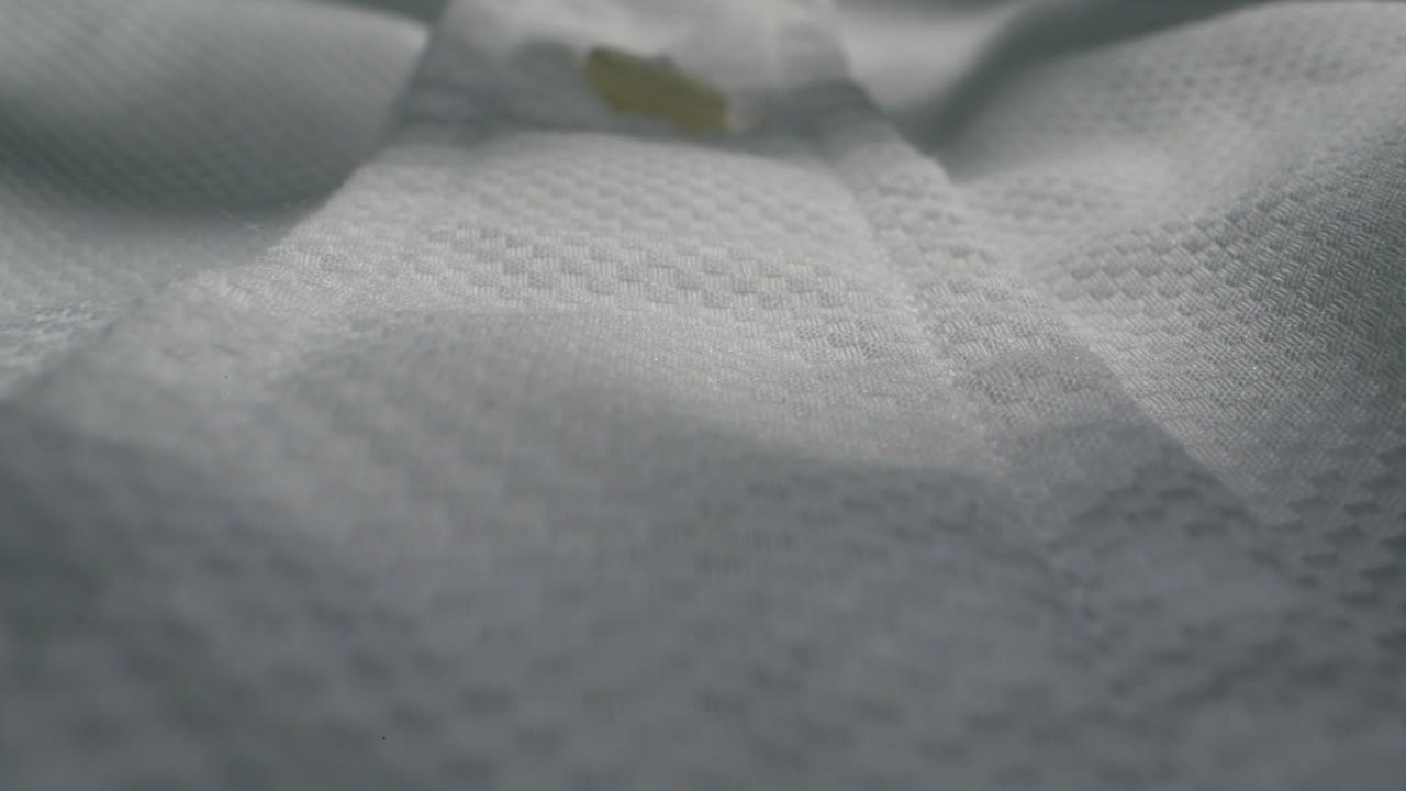 Closeup of an expertly tailored suit that beautifully showcases its sophisticated buttons and fine fabric texture