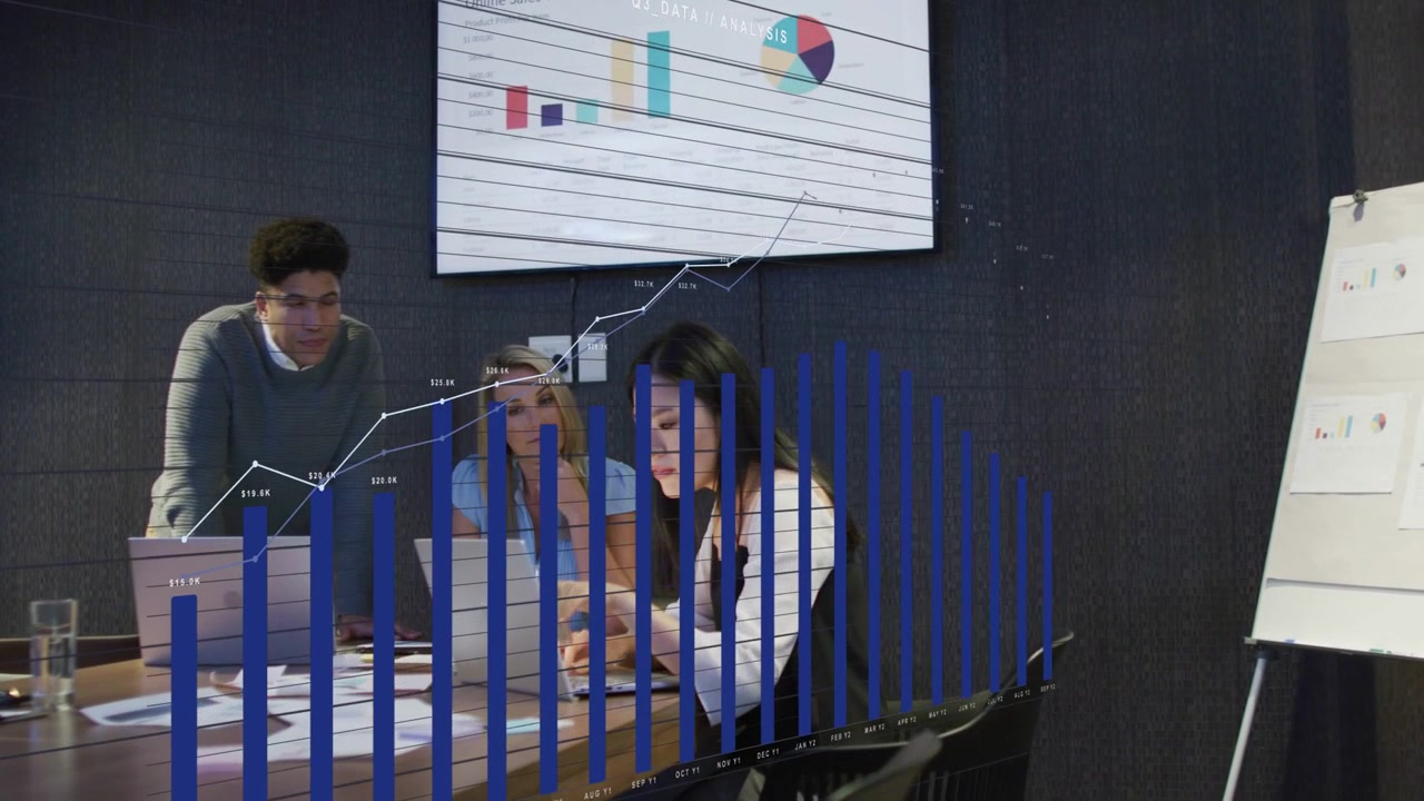 Vertical video: Reacting to data overlay, team in business attire leaning and using laptops at desk