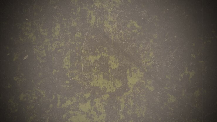 Worn-out wall with rough texture and patches of dirt and grime