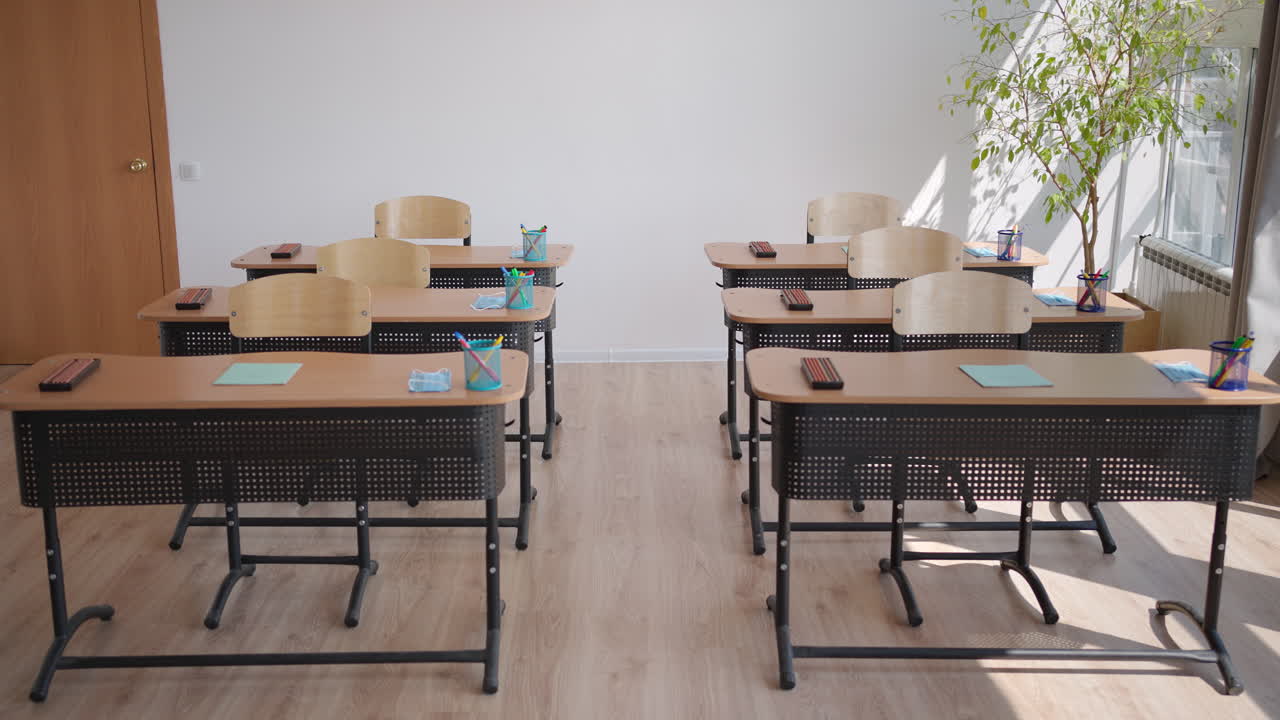 A school office during a pandemic with masks and social distance. The school is preparing to work in the mode of a coronavirus pandemic and epidemic. The interior of the school classroom