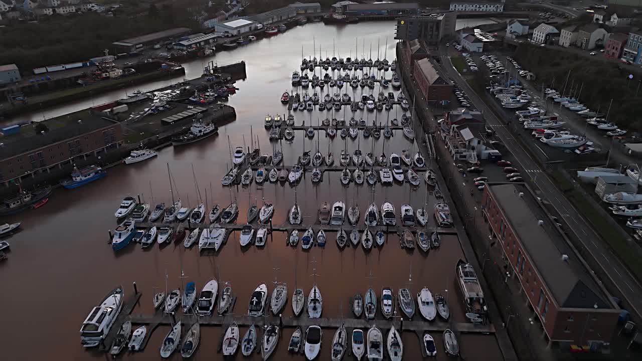 Aerial shot of boats docked at Milford Waterfront, Pembrokeshire, UK