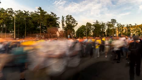 spectators and football fans out of the stadium after the match,time lapse