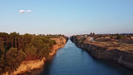 Blue-sky-background,-iconic-travel-route,-Corinth-Canal,-Aerial-reveal