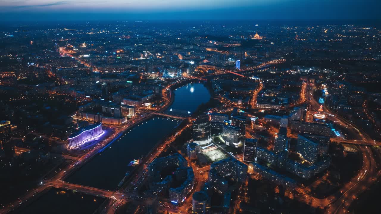 A stunning aerial view capturing a vibrant city skyline illuminated at night, showcasing twinkling lights reflecting off water, with buildings and roads creating a beautiful urban landscape