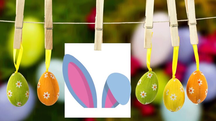 Animation of bunny ears on white paper and multi coloured easter eggs hanging with pegs