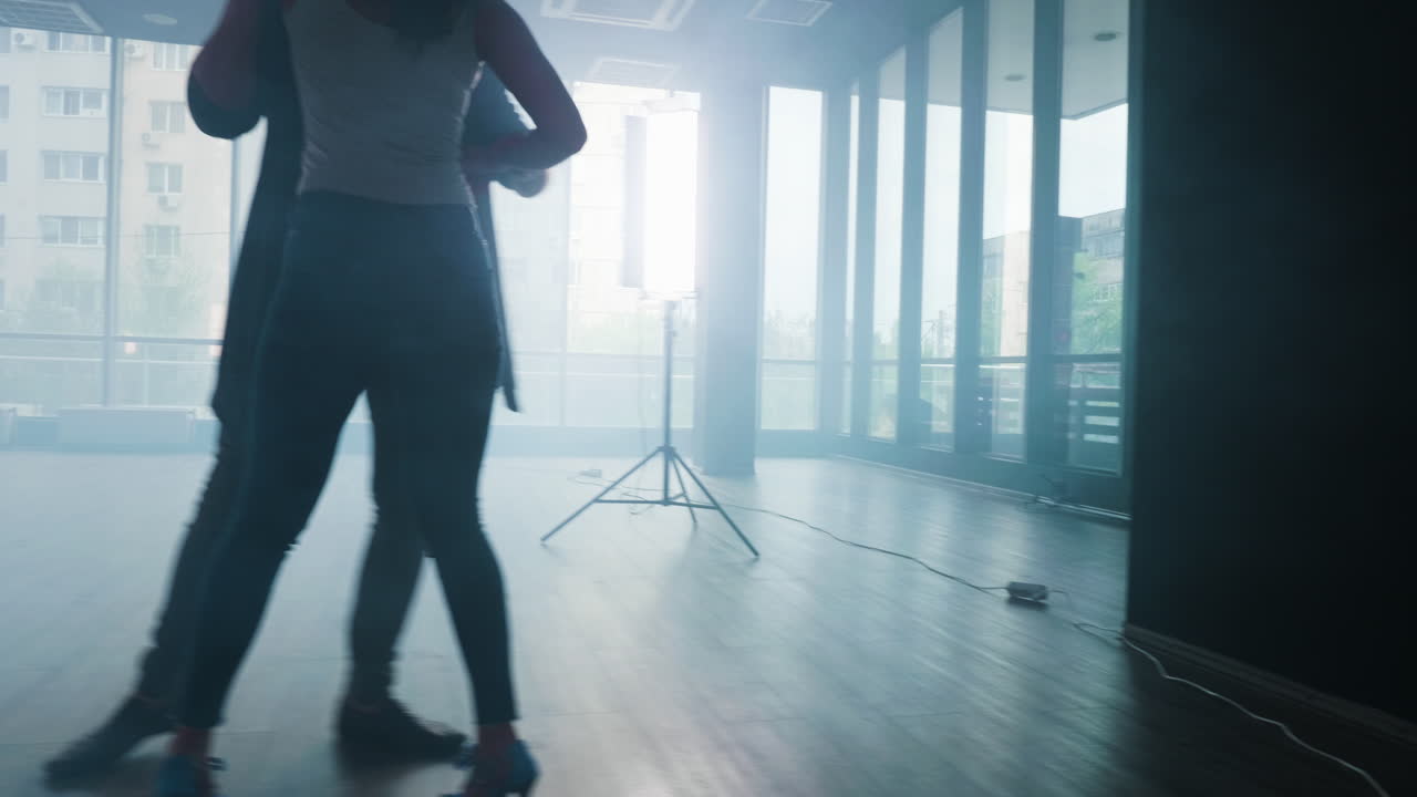 Couple dancing in a dance studio
