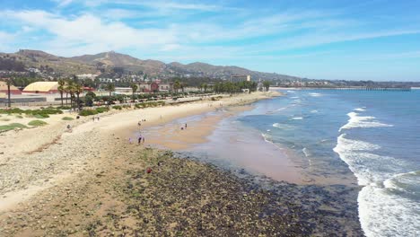 aerial over surfer's point with city of ventura california shore and beach near the ventura river background