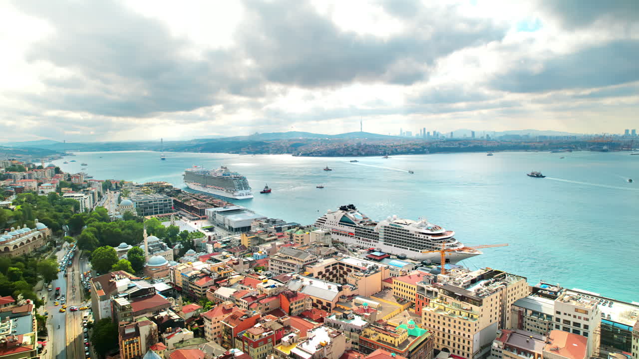 Aerial drone view of Istanbul, Turkey. Bosporus strait with multiple floating and moored ships, residential buildings, mosques, cityscape on the background