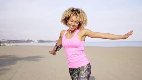 Playful-young-carefree-fit-adult-at-beach