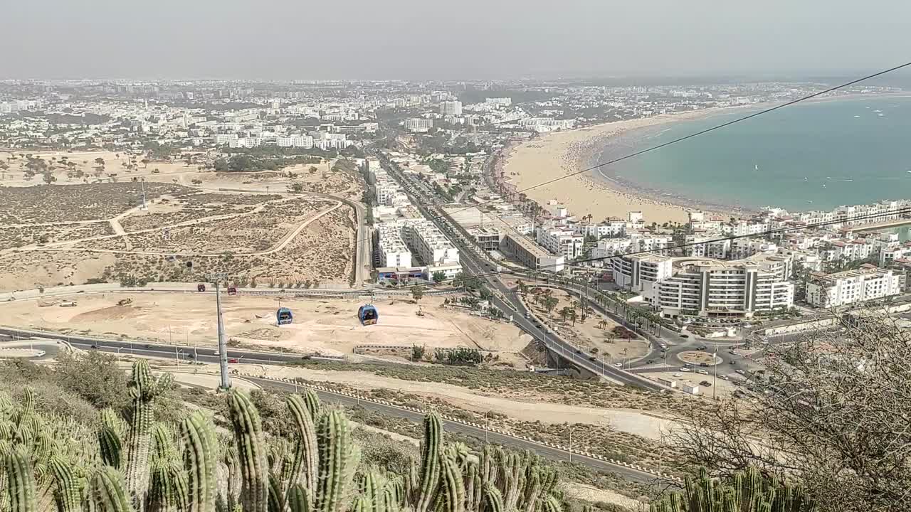 Cable car of the aerial tramway connecting Oufella peak and Agadir city in Morocco, overlooking a panoramic view of the beach-6
