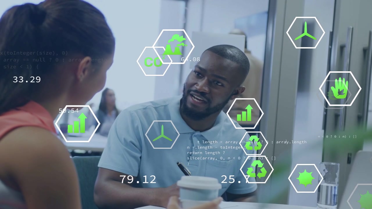 Man glancing up from notes, engaging woman, discussing business metrics with floating hex icons