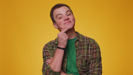 Cheerful-lovely-teenager-adult-man-fashion-model-in-shirt-smiling-and-looking-at-camera-alone