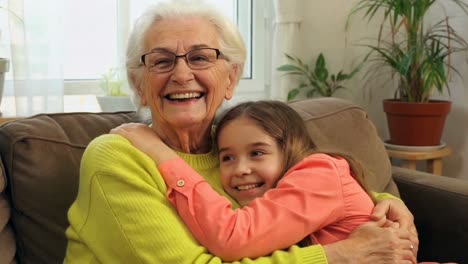 happy granddaughter hugging her loving grandmother with joy