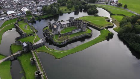 medieval castle surrounded by moat in caerphilly, south wales