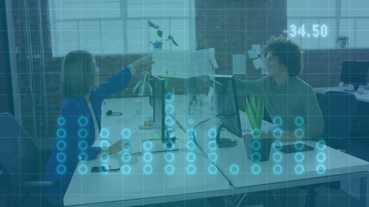 Two people working at desks with digital data animation overlay