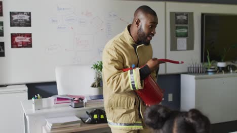 video of happy african american teacher with class of diverse pupils during ohs lesson