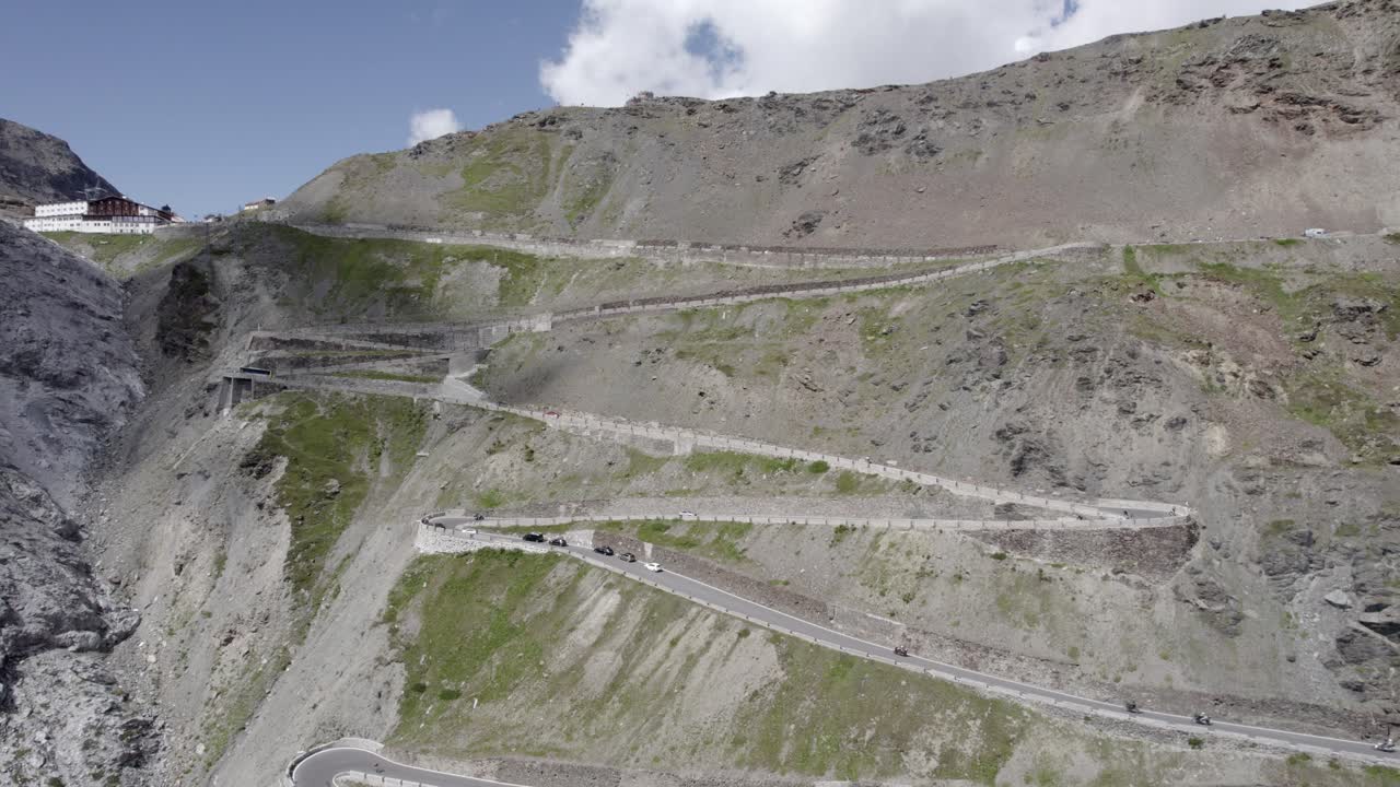 video with plane drone ascent crane on climb of the stelvio pass