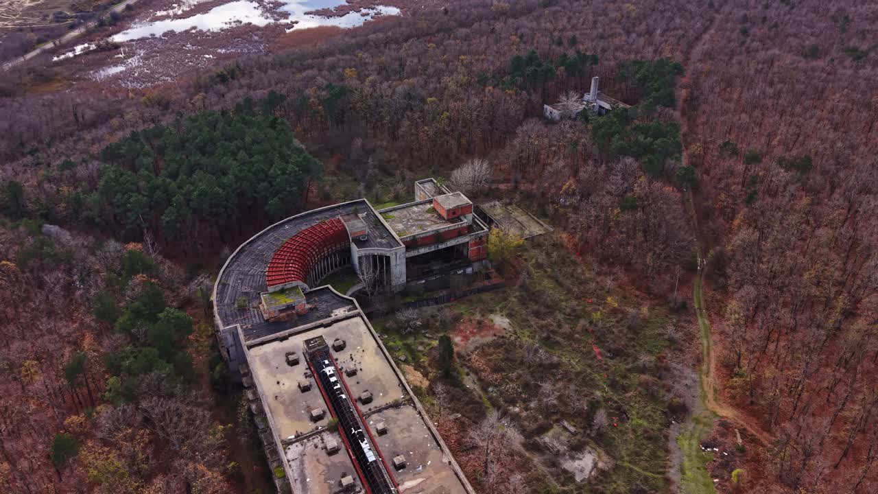 Exploring a forgotten building in the woods during autumn