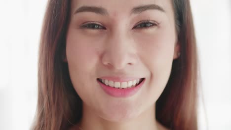 close up of very beautiful asian woman smiling in a very cute way and very happy