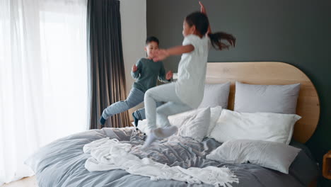Happy,-bed-and-children-jumping-in-the-morning