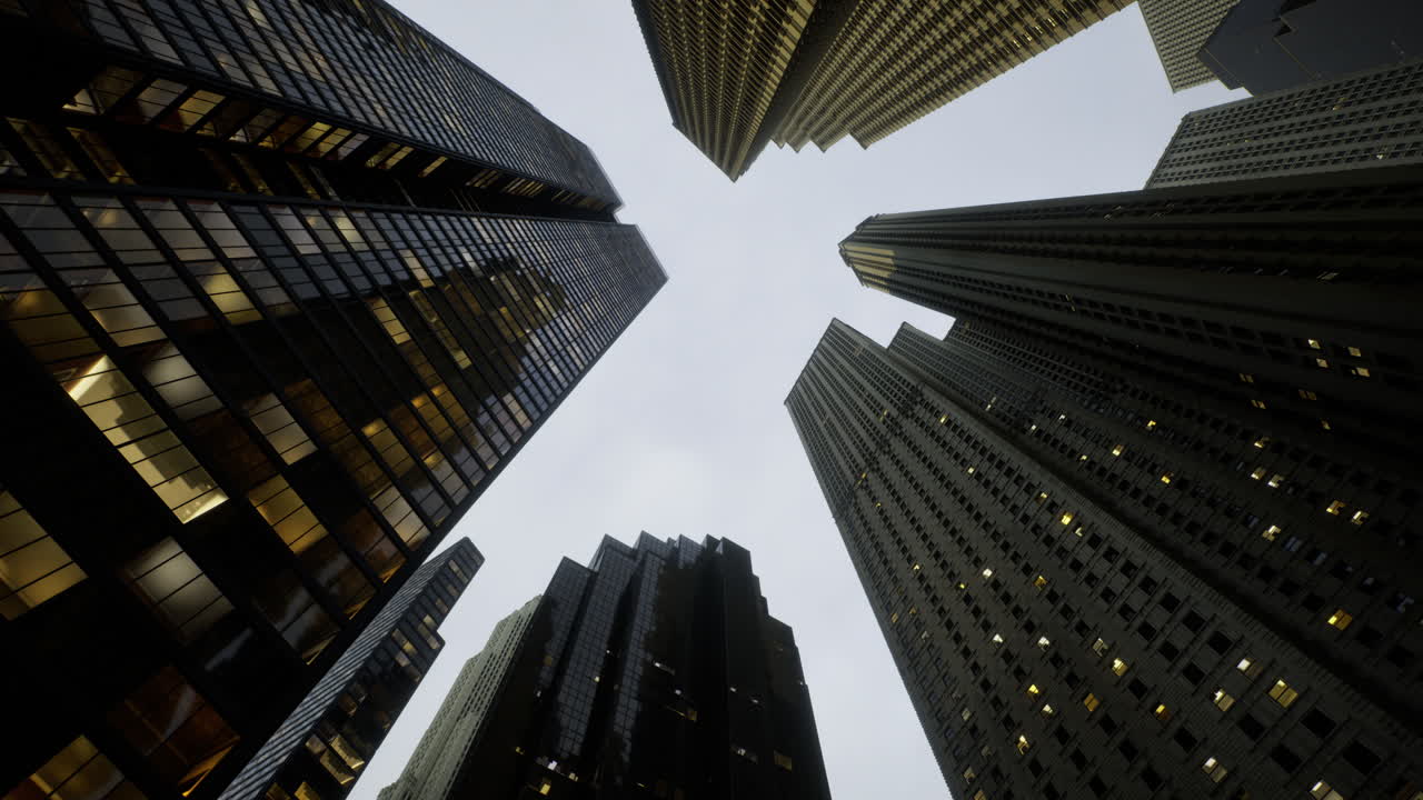 View of modern skyscrapers against a gray sky in an urban city center
