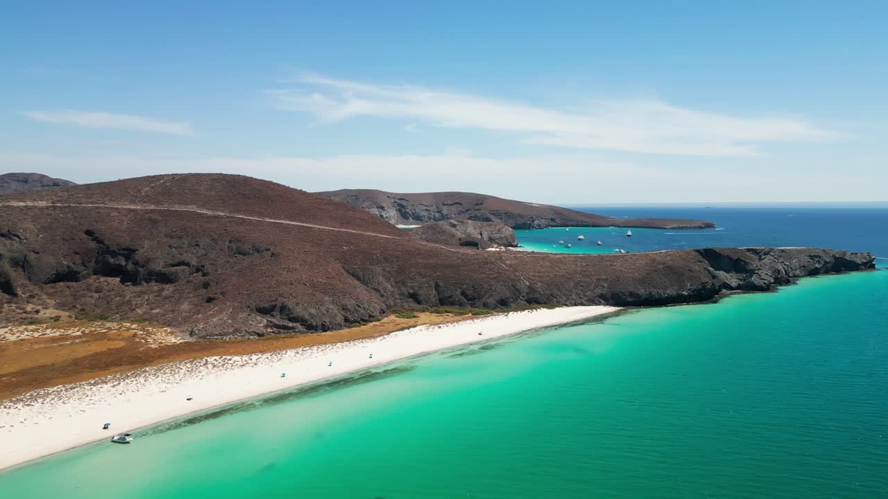 Clear blue waters at Tecolandra Beach in La Paz, Mexico, perfect for relaxing