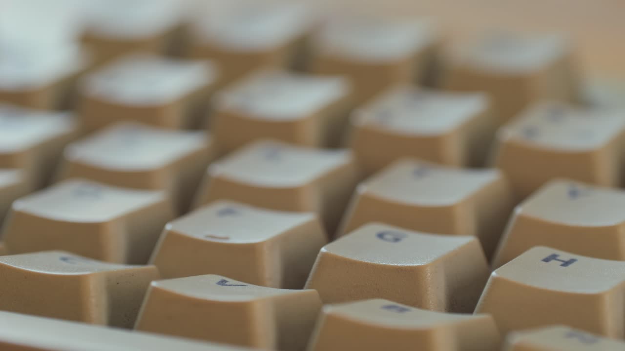 Man working and gaming on retro computer PC, IT engineer with vintage computer at home, using old fashion technology, close up of retro setup.