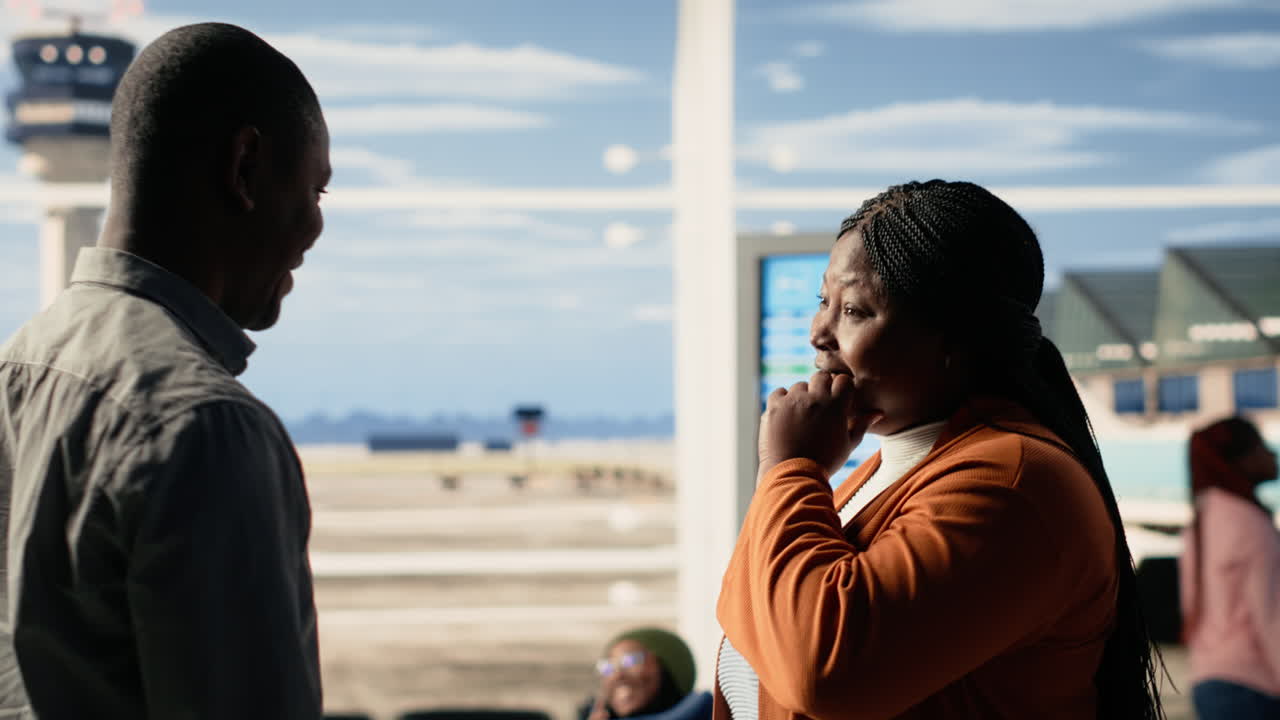 Emotional airport farewell with parents saying goodbye to teen daughter