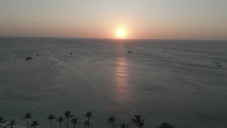 AERIAL:-Drone-shot-of-beautiful-sunset-with-ships-in-the-water