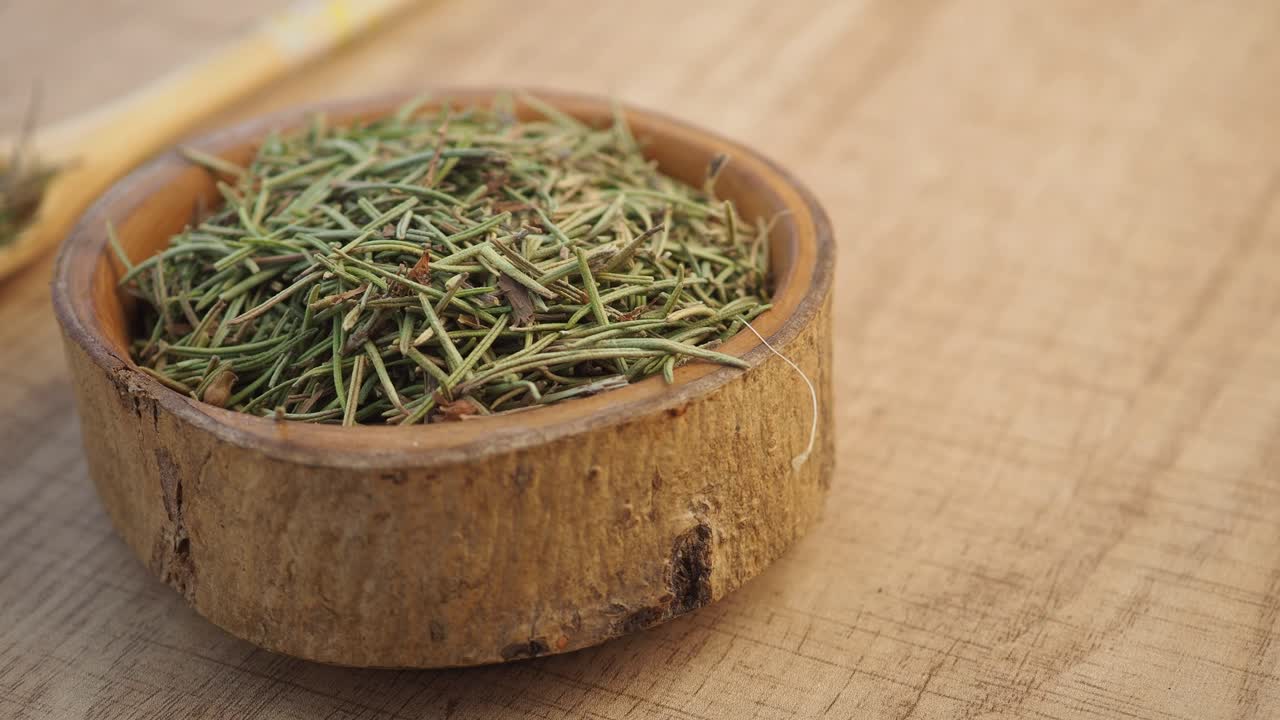 Dried Rosemary in a Wooden Bowl